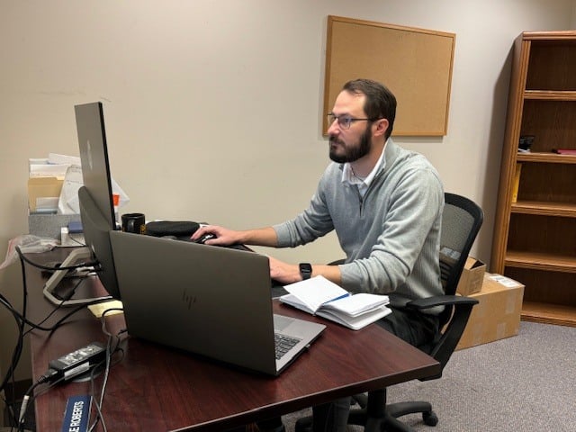 Alex W at desk 3 Alex W at desk 3